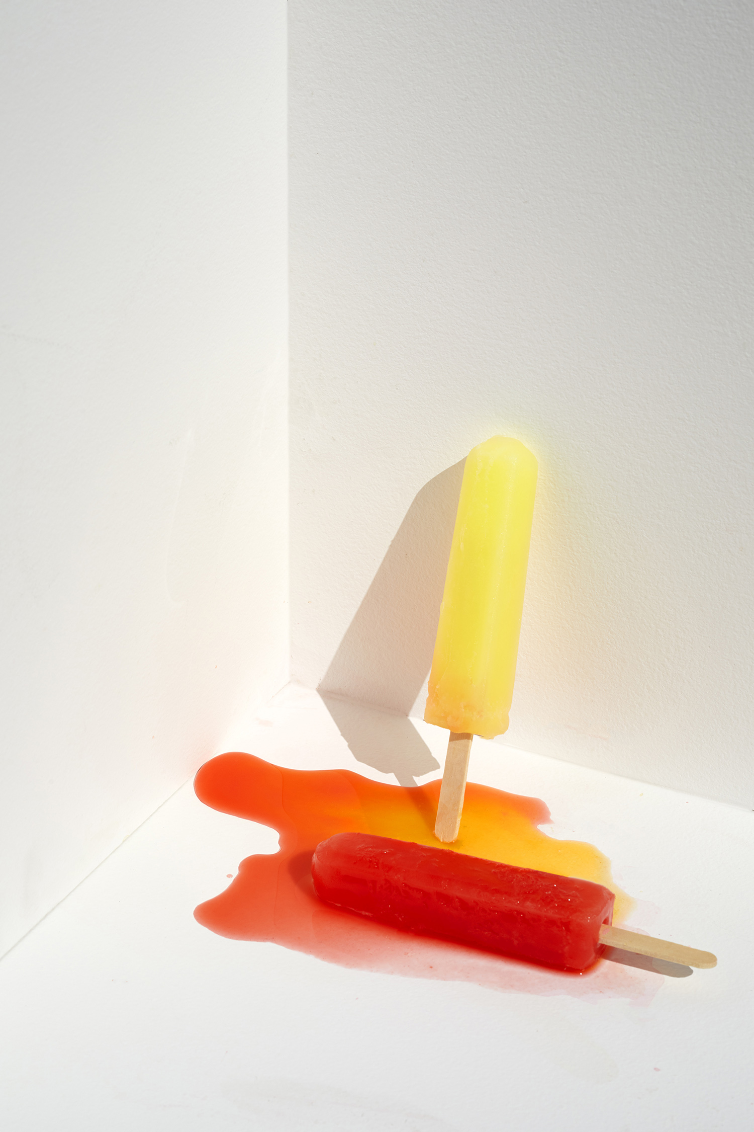 Popsicle melting still life on a hot summer day